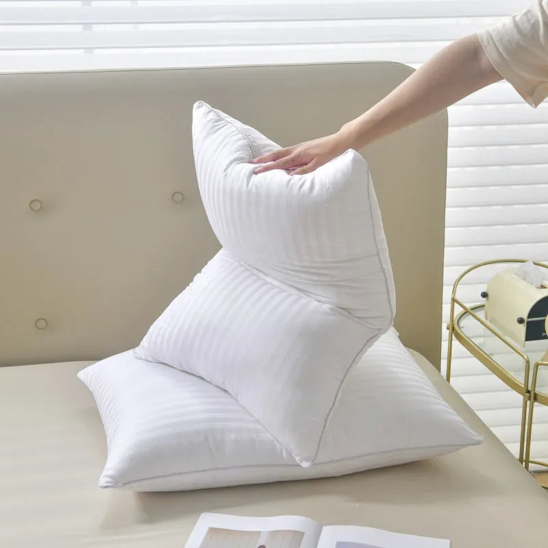 White cotton satin stripe feather pillow showing satin stripe detail on 99% cotton fabric.