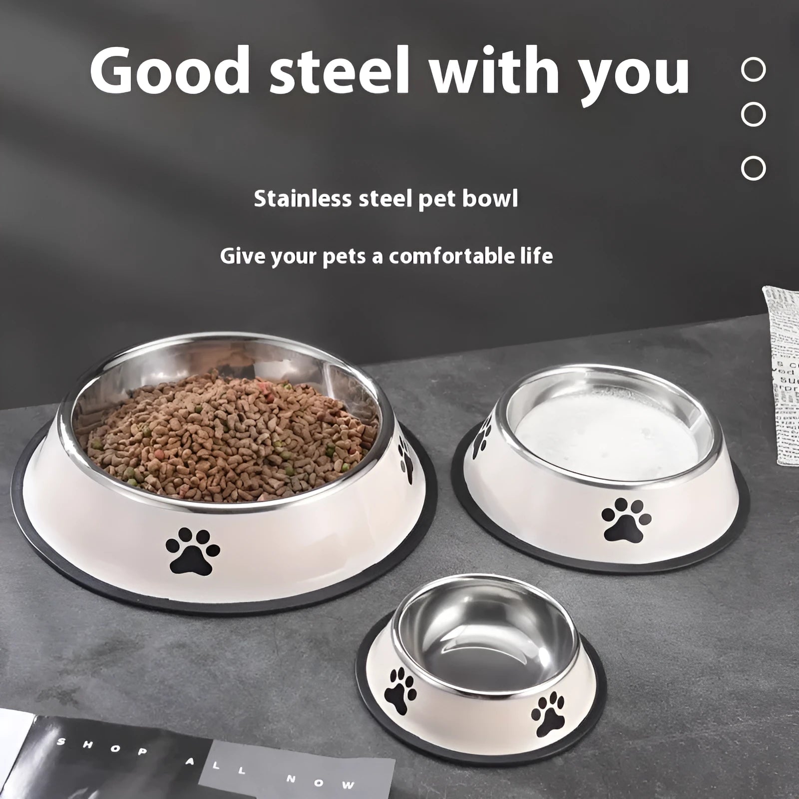 Printed non-slip stainless steel pet bowl for dogs and cats in gray, shown on a floor