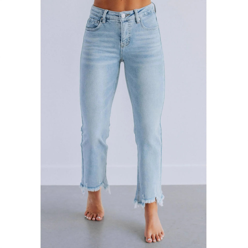 Women's solid colour cotton denim jeans with manual distressing in dark blue and light blue options