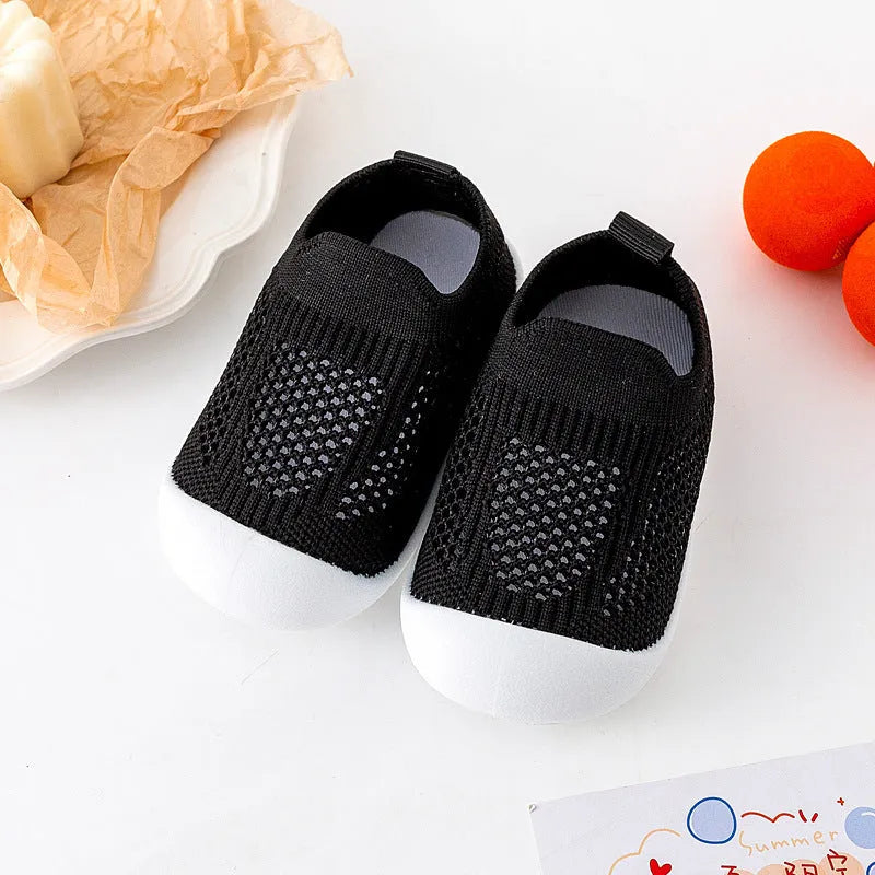 Baby soft sole non-slip walking shoes in cream yellow with fly woven cotton upper and natural rubber sole