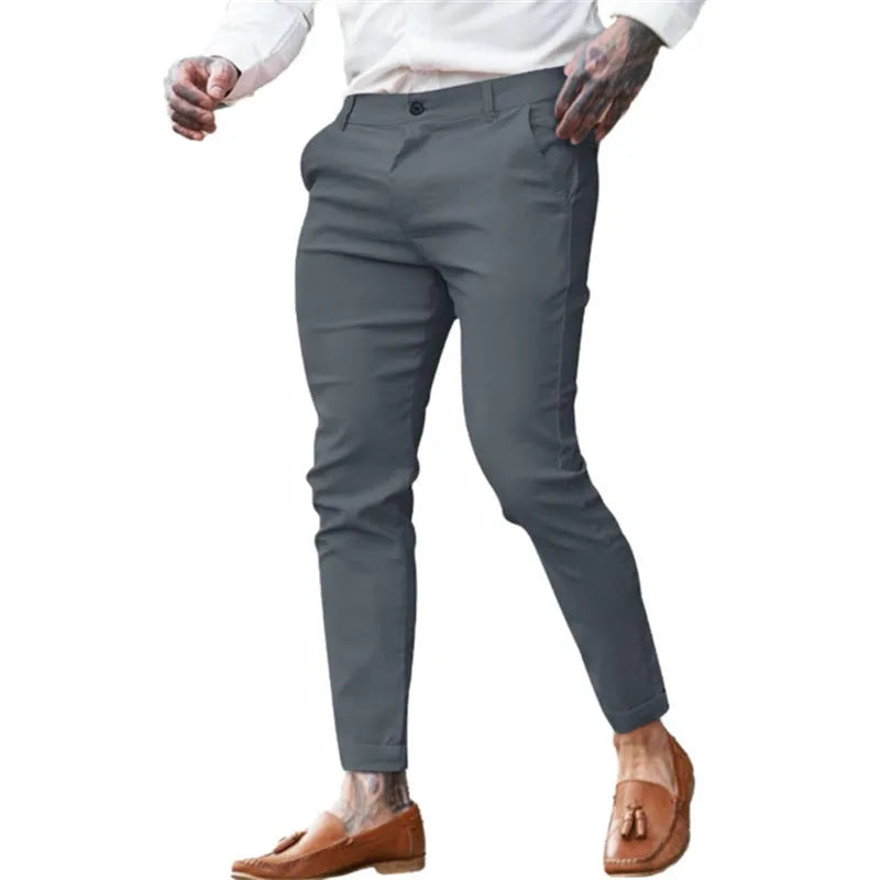 Men's slim fit pencil trousers in cotton twill stretch fabric on a hanger.