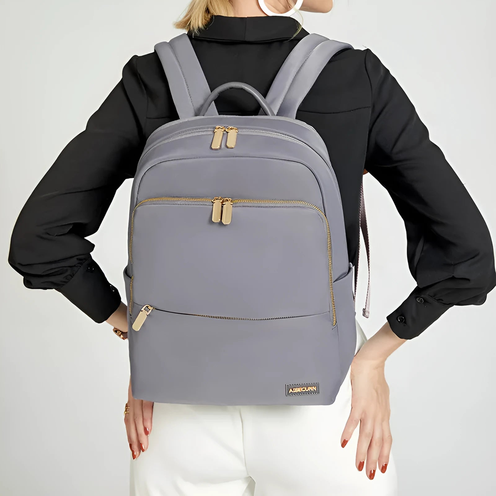 Oxford cloth women's backpack in black and purplish grey, showing large capacity and design features.