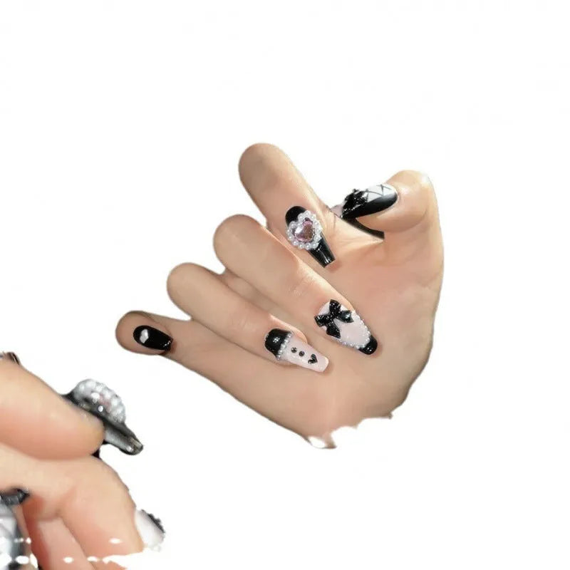 Black peach heart detachable manicure nails with hand-painted bow and XINGX patterns