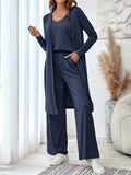 Women's blue polyester co-ord suit set with sling top, long cardigan, trousers and suspenders