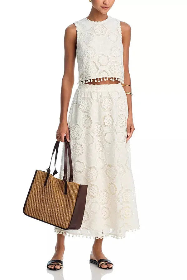White women's retro style suit set with embroidery, featuring a sleeveless top and a long skirt.