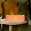 Creative square lava flame aroma diffuser and humidifier on a desktop with colourful LED light effect.