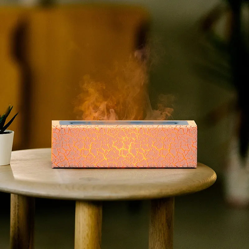 Creative square lava flame aroma diffuser and humidifier on a desktop with colourful LED light effect.