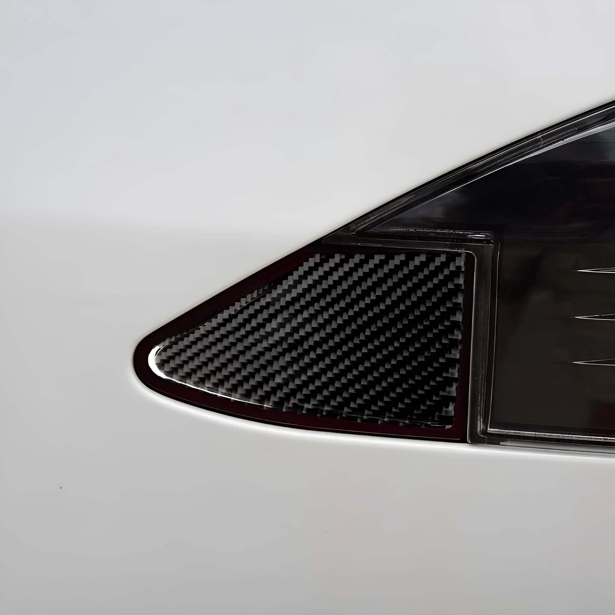 Carbon fibre textured USB charging port panel decorative sticker with 3M adhesive backing.