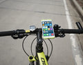 Bicycle phone holder with tough silicone strap and pull buckle, on handlebar, in black