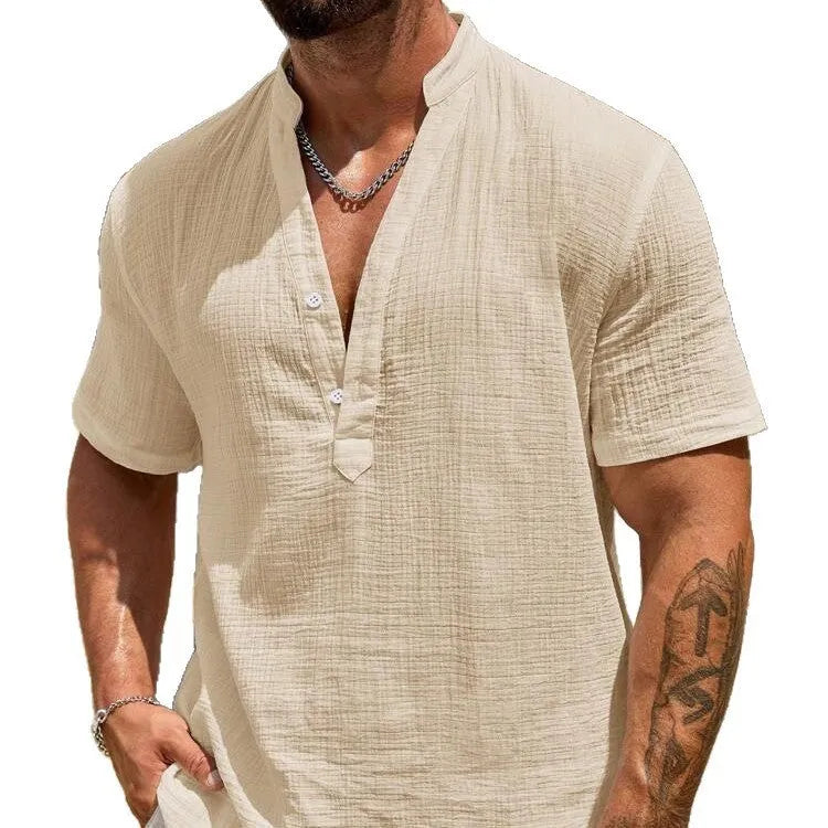Men's solid colour stand collar short-sleeved shirt in a light blue shade, showing the slit detail and casual fit.
