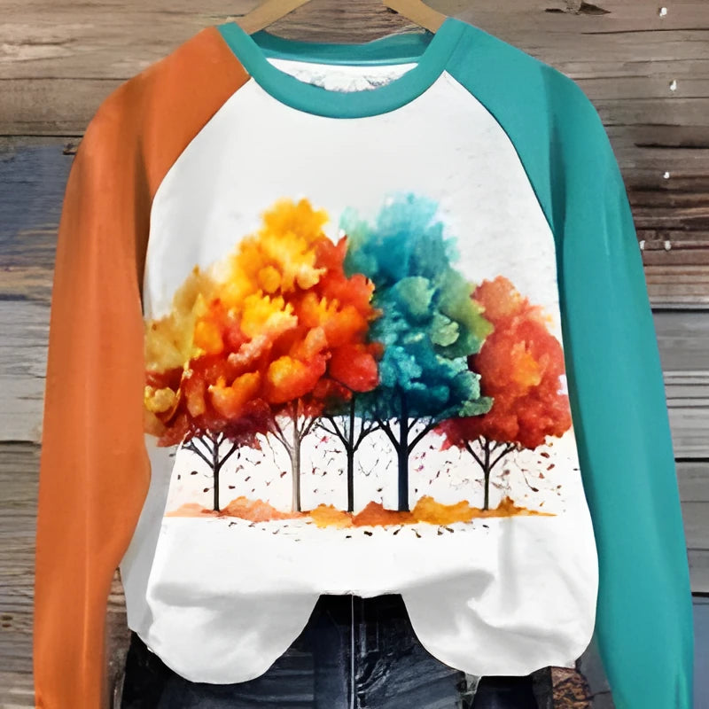 Green women's hoodie with a raised 3D digital print of cartoon characters, showing front view.