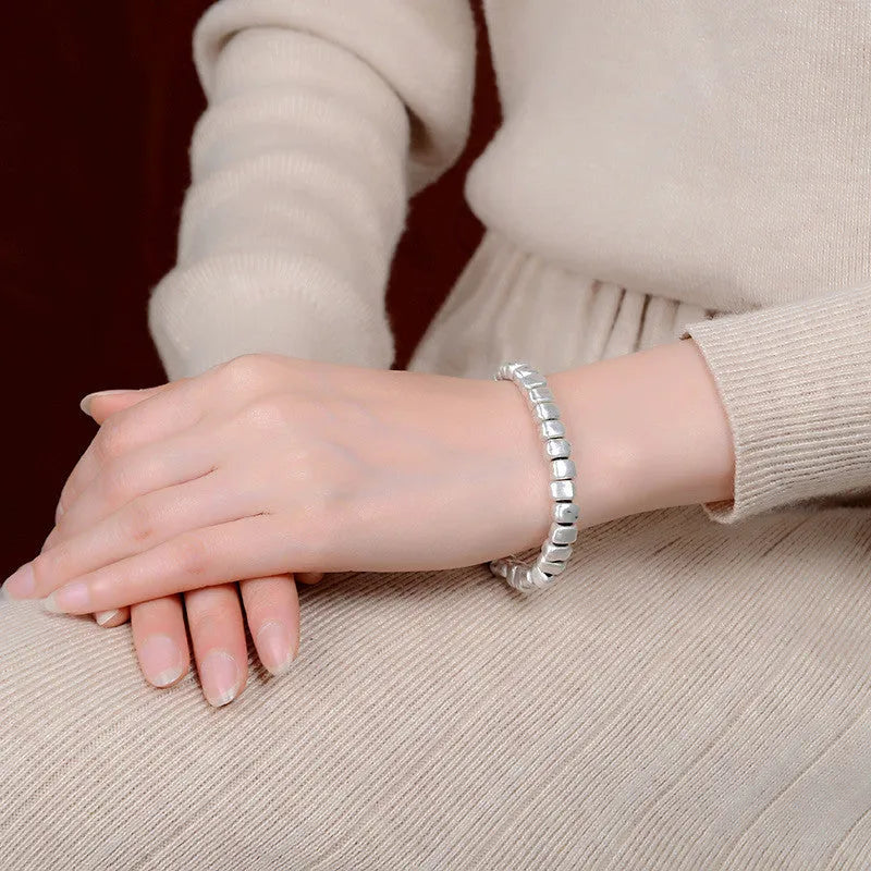Women's handmade irregular silver square bracelet with wooden charm on elastic band