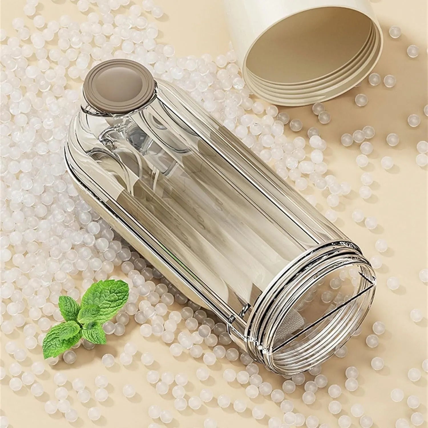 Beige and green foldable dog water bottle with food container, 21.5cm tall with leak-proof design