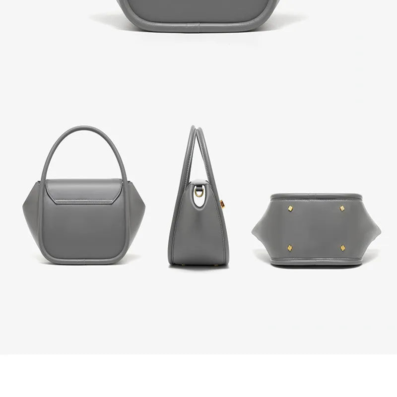 Soft wing-shaped leather cross-body tote bag in cow leather with a buckle and latch closure.