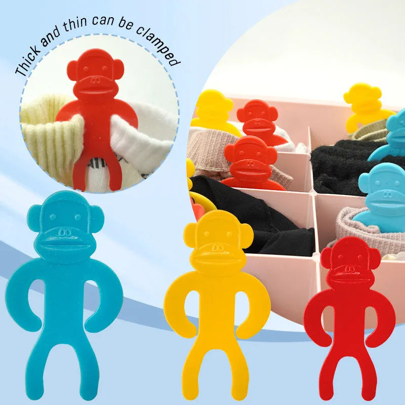 Plastic socks clips in blue, red and yellow colours for machine wash laundry organisation
