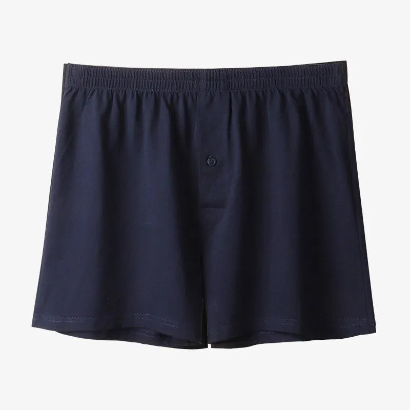 Men's high waist cotton boxer shorts in loose fitting design showing solid colour options