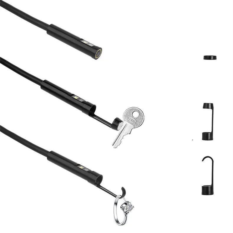 F300 WiFi dual lens endoscope inspection camera with magnet and hook accessories on a table