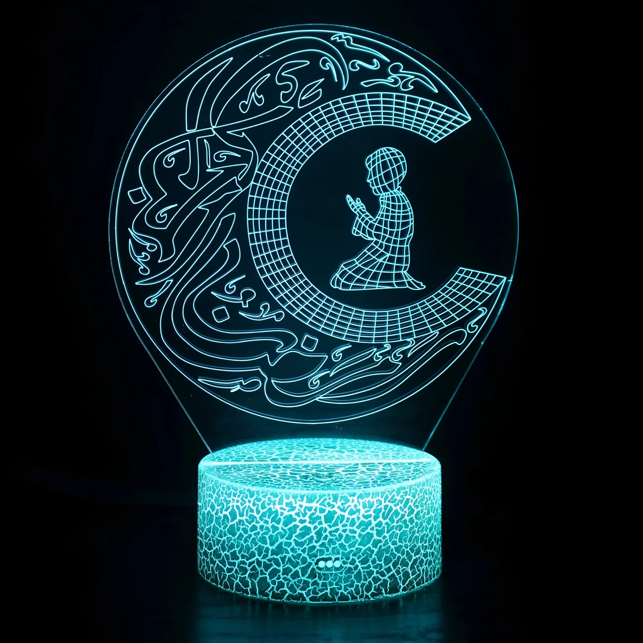 3D small night lamp with touch and remote control showing colourful LED illumination on a bedside table