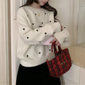 Women's acrylic pullover sweater with embroidery detail in milky white colour