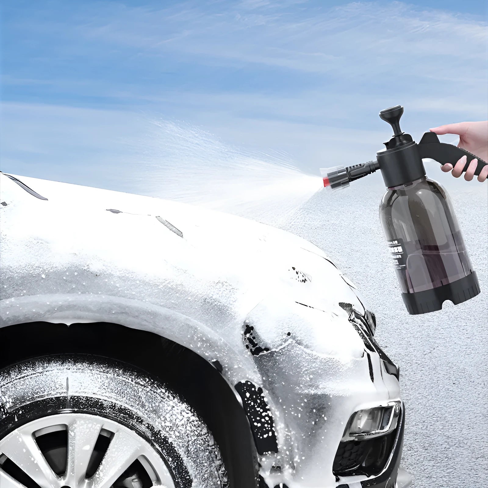 Black 2L foam watering can sprayer with handle and two nozzle attachments on a white background