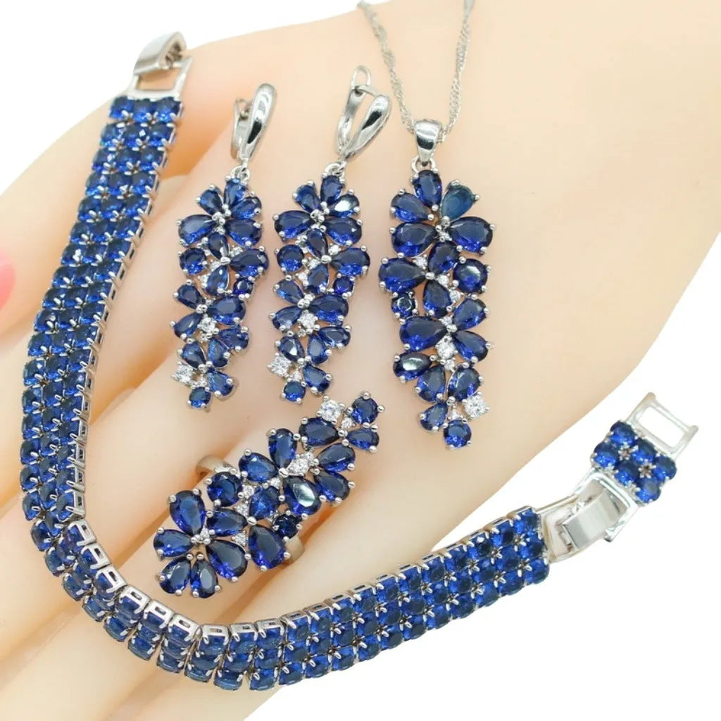 Dark blue copper inlaid zircon retro jewellery set including necklace, earrings, ring, and bracelet on display