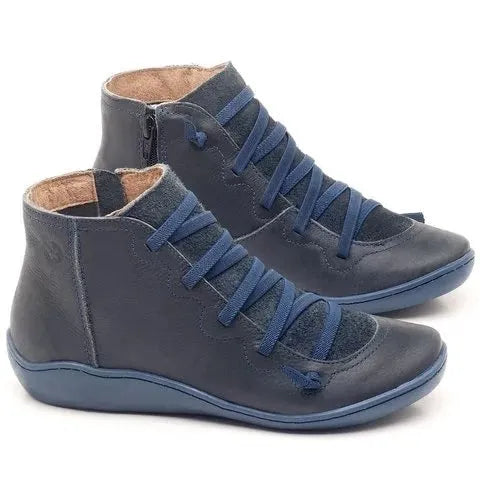 Women's black casual flat wedge heel ankle boots with round toe and rubber sole.
