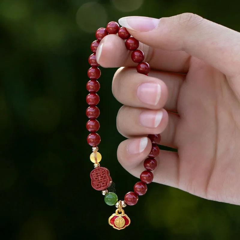Happy Eyebrow Bracelet with fu character charm in cinnabar emperor sandstone beads.