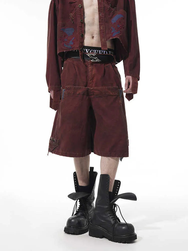 Men's double waist loose cropped pants in black with washed stitching, front view