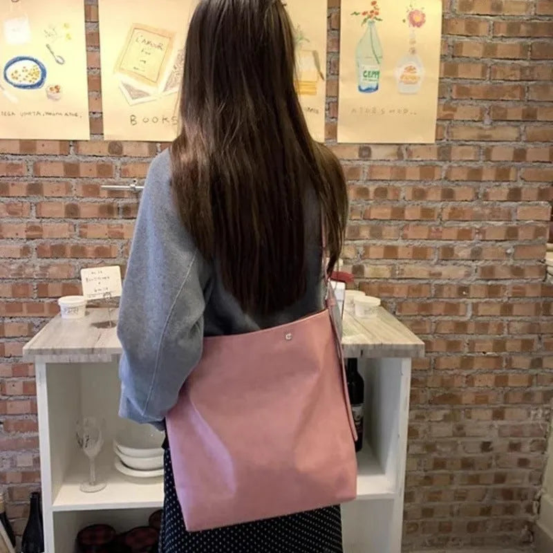 Pink corduroy one-shoulder bag with PU lining showing dimensions 39×32×11cm