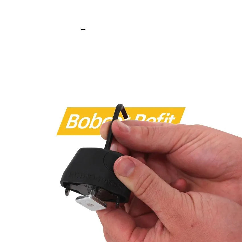 Plastic-sheathed steel cable lock for roof platform securing a ladder, showing no-drill installation.