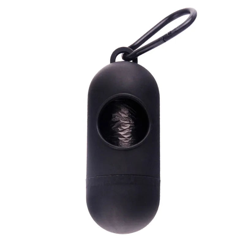 Compact black dog waste bag dispenser with a side hook and Velcro strap for attachment.