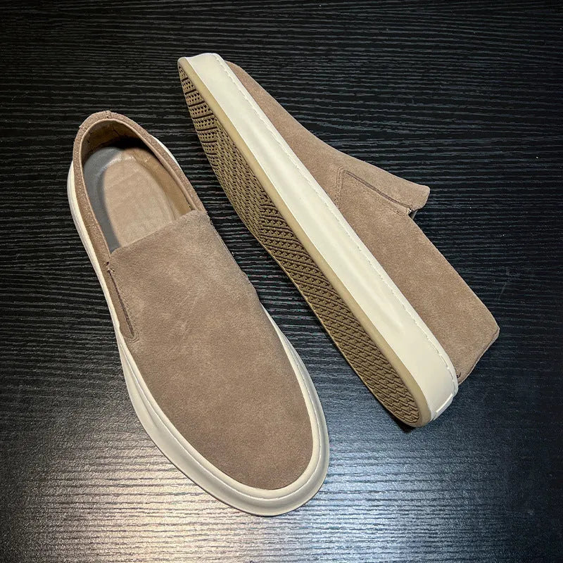 Men's casual shoes in solid grey colour with round toe, mid heel, and sewing line detail
