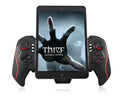 Telescopic wireless game controller extended to hold a mobile phone, showing USB connector.