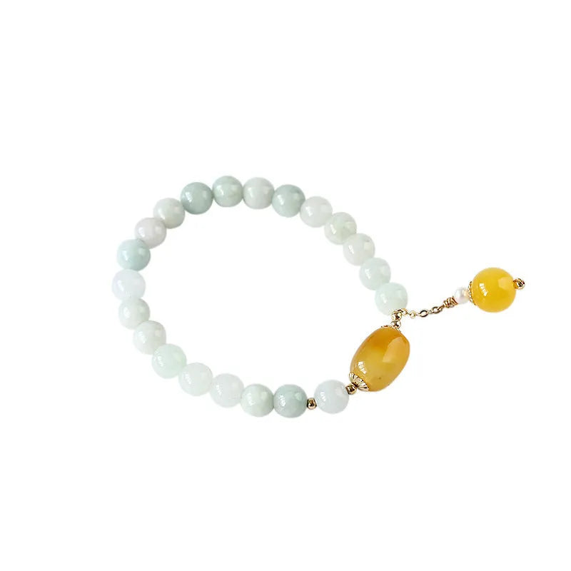 Women's bracelet with red agate round beads 7.5mm and hanging tassel in 14K gilded finish