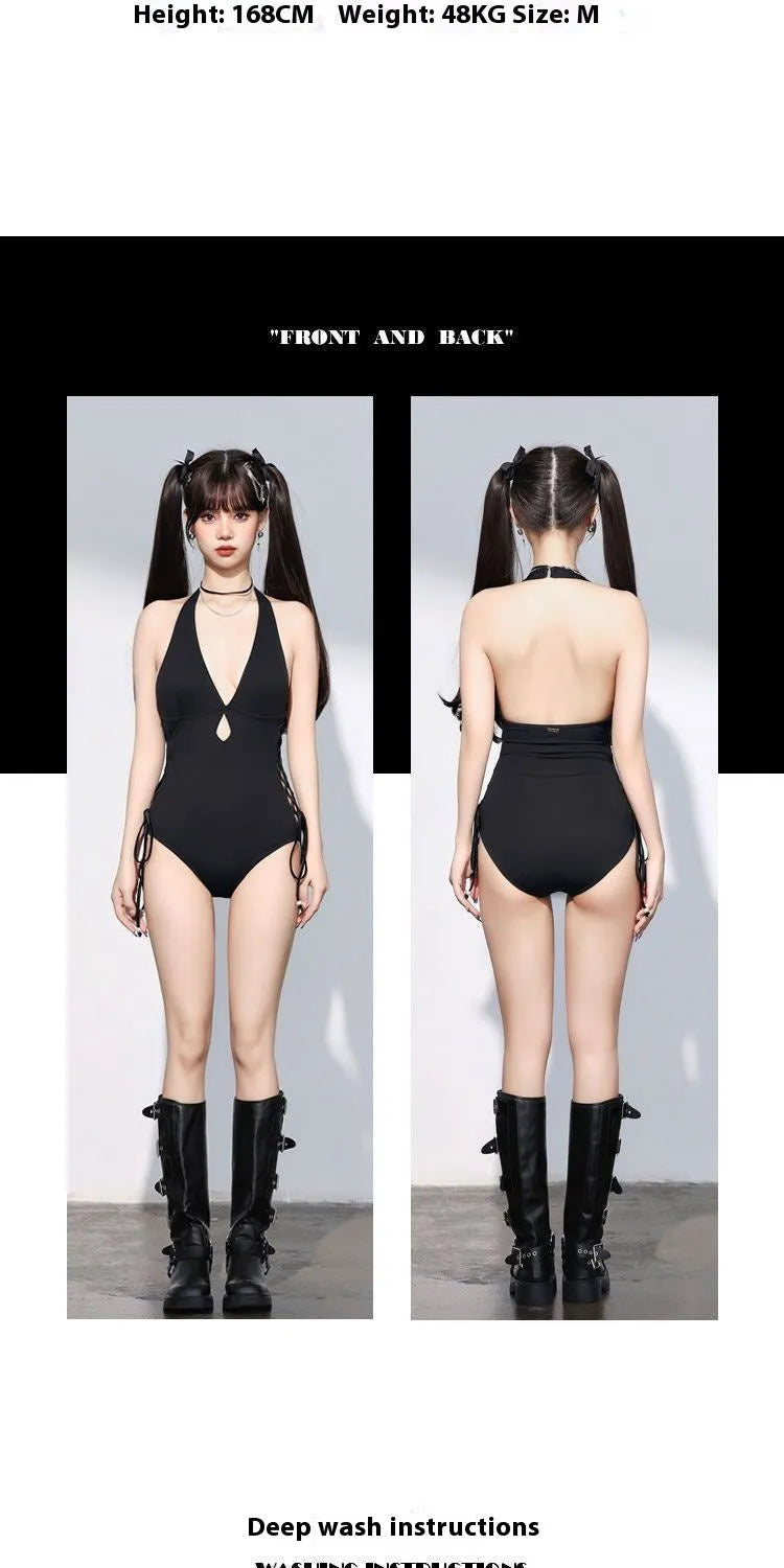 Women's black V-neck hollow strap niche one-piece swimsuit on plain background