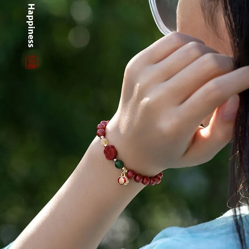 Happy Eyebrow Bracelet with fu character charm in cinnabar emperor sandstone beads.