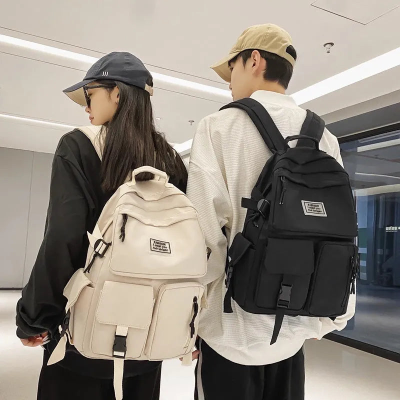Soft nylon student backpack with computer compartment and three-dimensional pockets in black colour