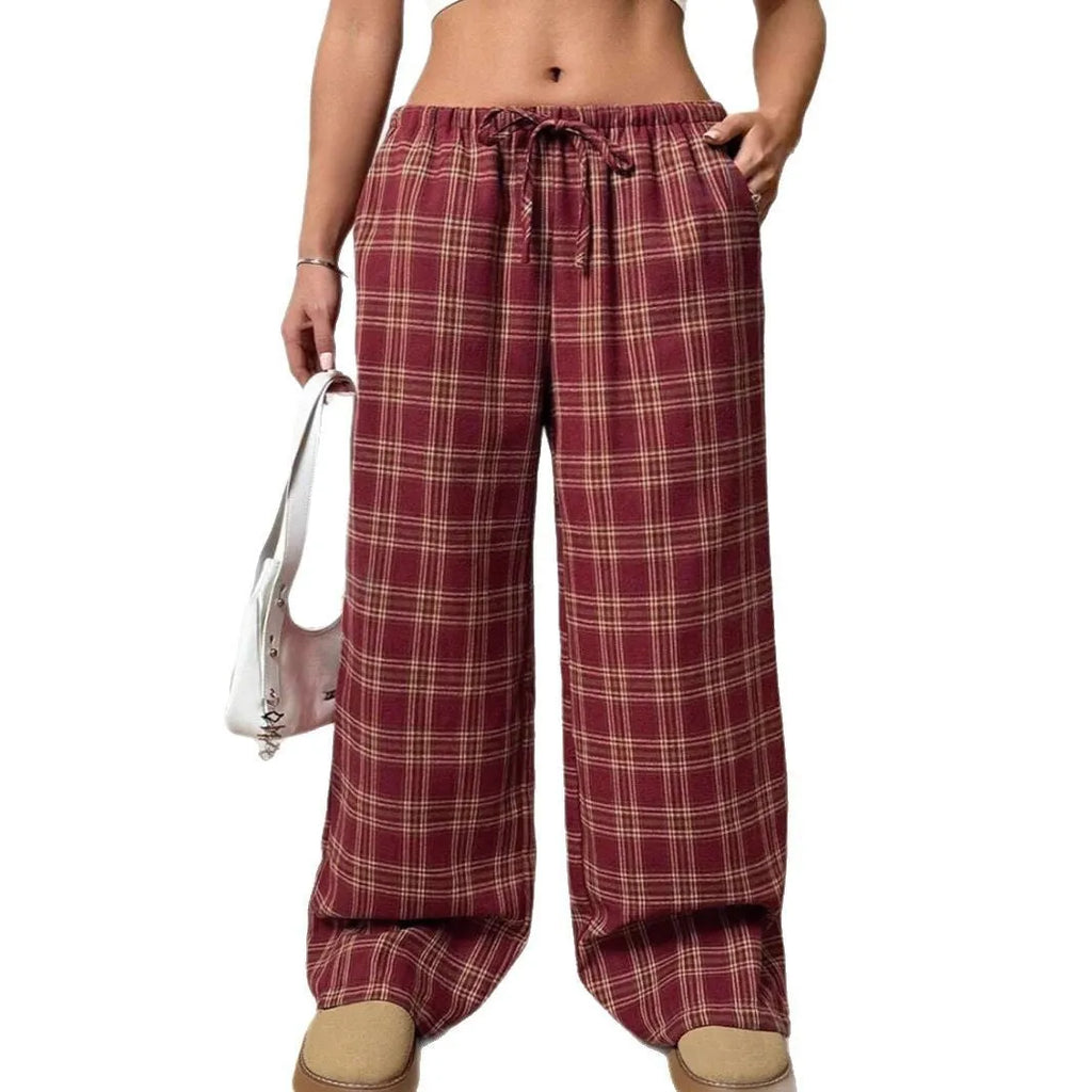 Women's red casual loose trousers with drawstring waist and plaid patch pockets laid flat.