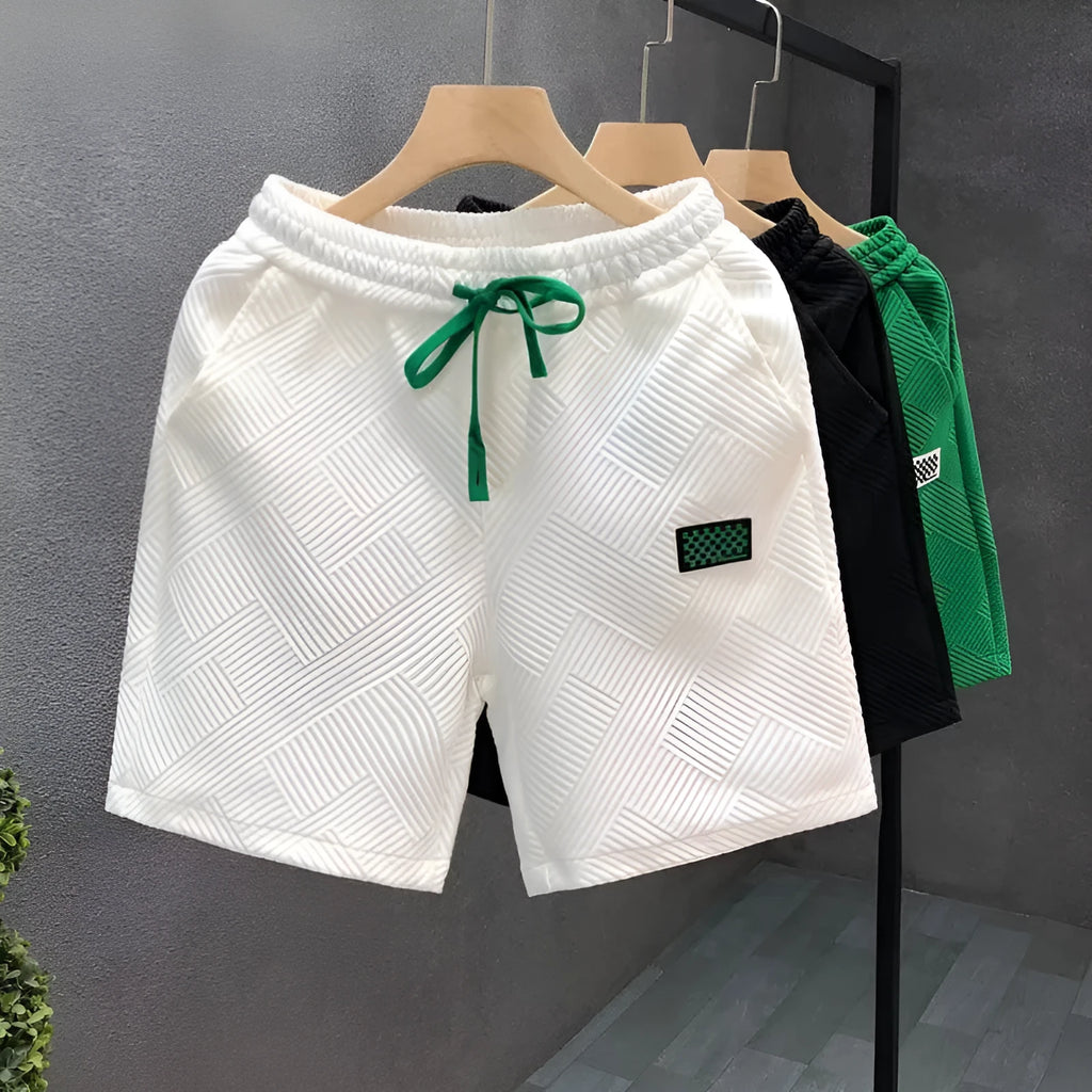 Casual micro-elastic polyester sports shorts in solid white, black, or green colours with American style design