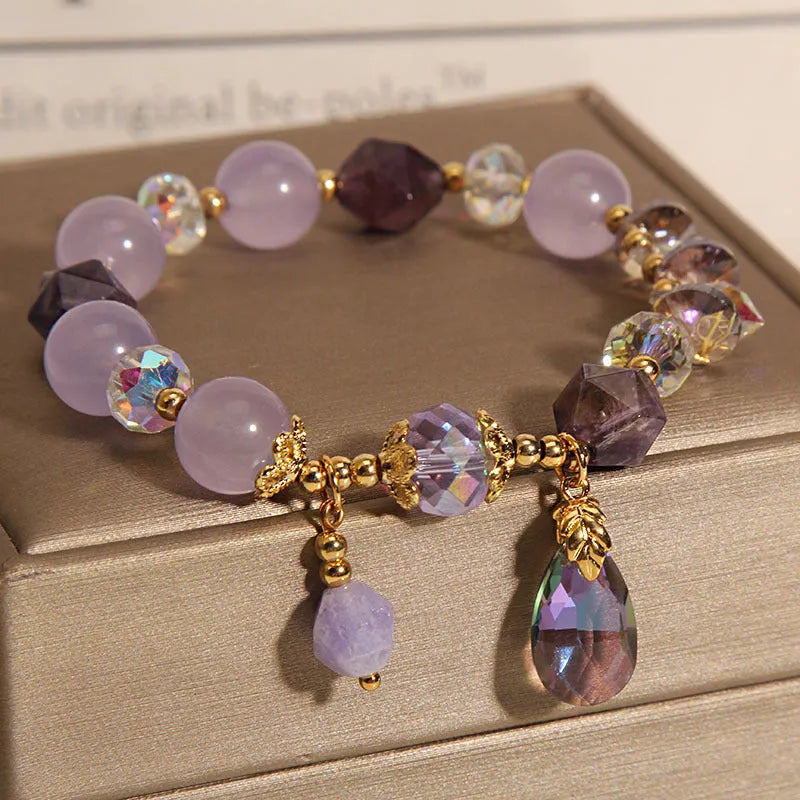 Lavender purple crystal water drop bracelet for children on display, retro original design