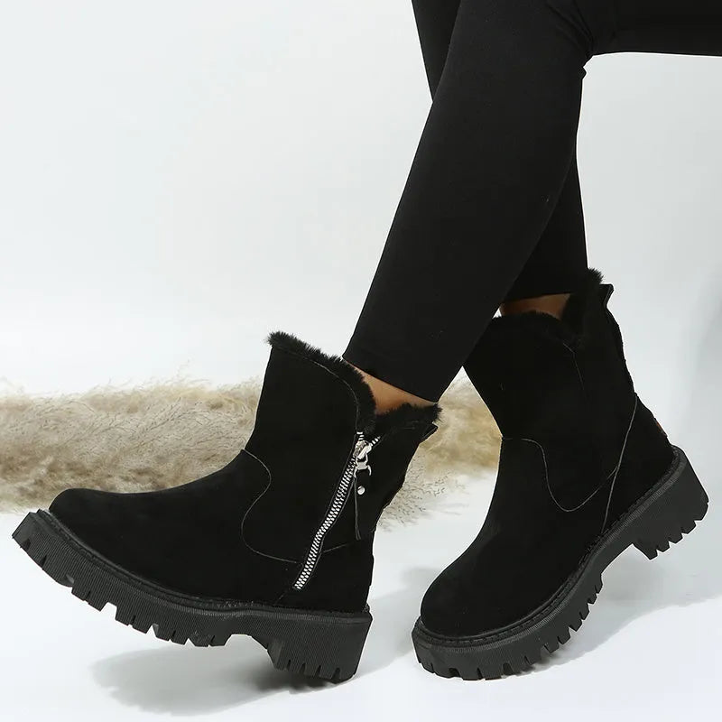 Women's black high-top snow boots with faux suede upper, side zipper, and thick plush lining.