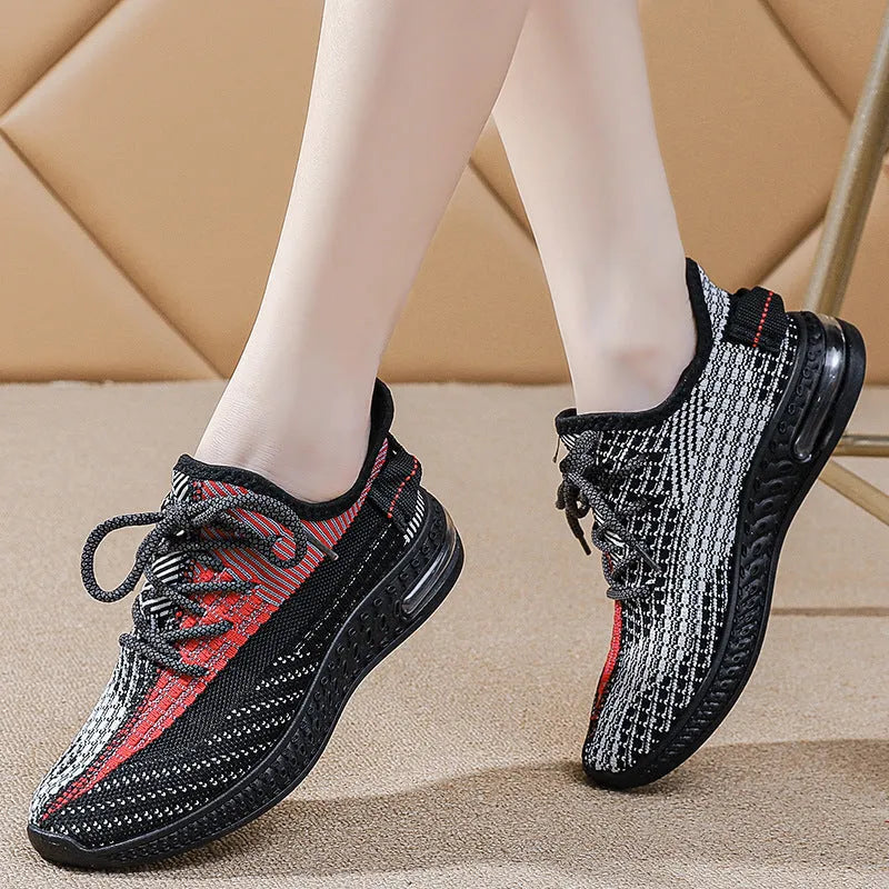 Women's lightweight breathable lace-up running shoes in black with round toe and low top profile