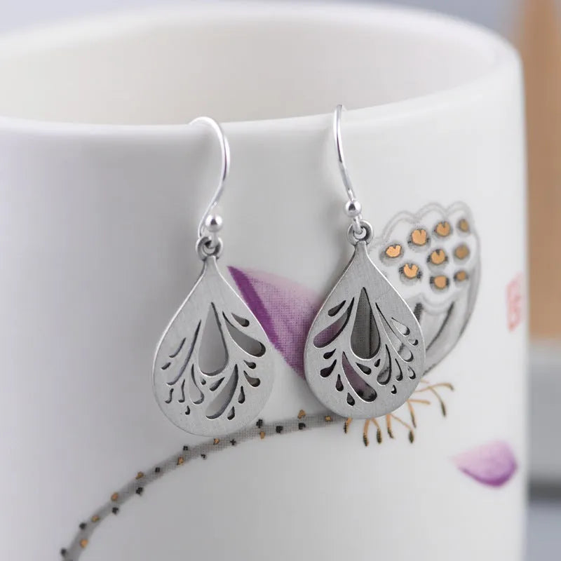 Retro 925 silver hollow water drop shape earrings for women, small stud style with hand ground finish