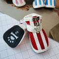 Four blue cloth dog sneakers with zipper closures and non-slip soles for small breeds