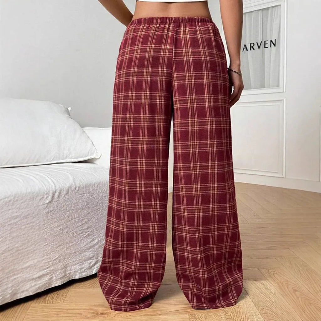 Women's red casual loose trousers with drawstring waist and plaid patch pockets laid flat.