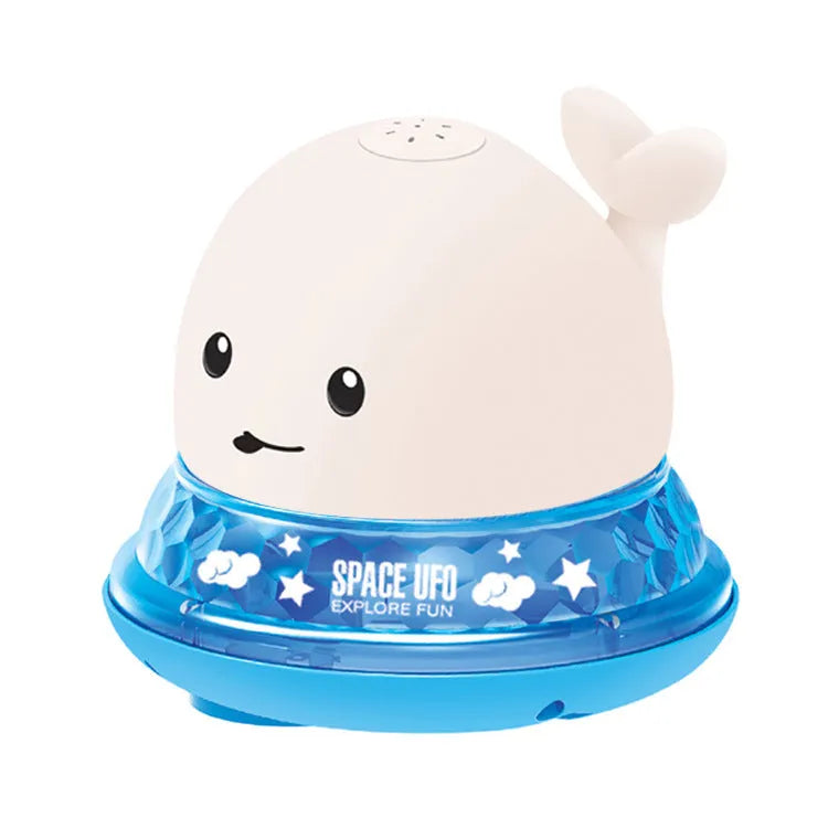 White and blue electric whale bath toy spraying water with lights on a base.