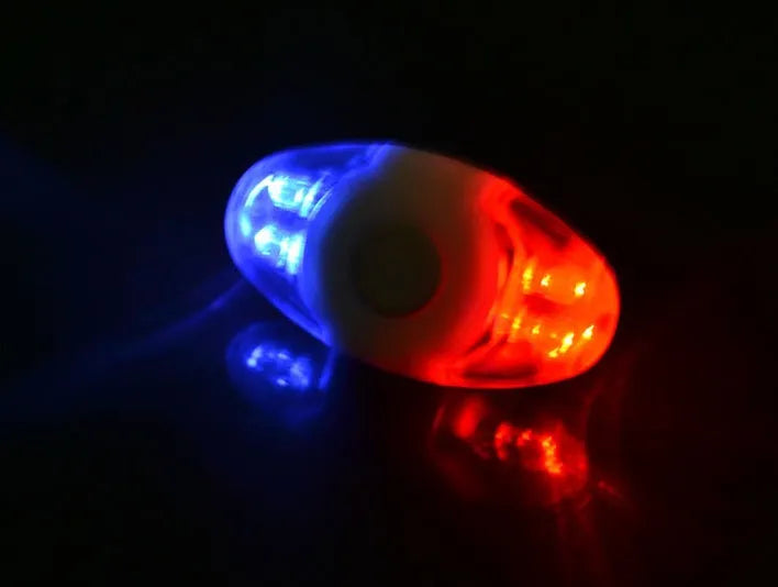 Red and blue LED bicycle tail light with an adjustable mounting base.