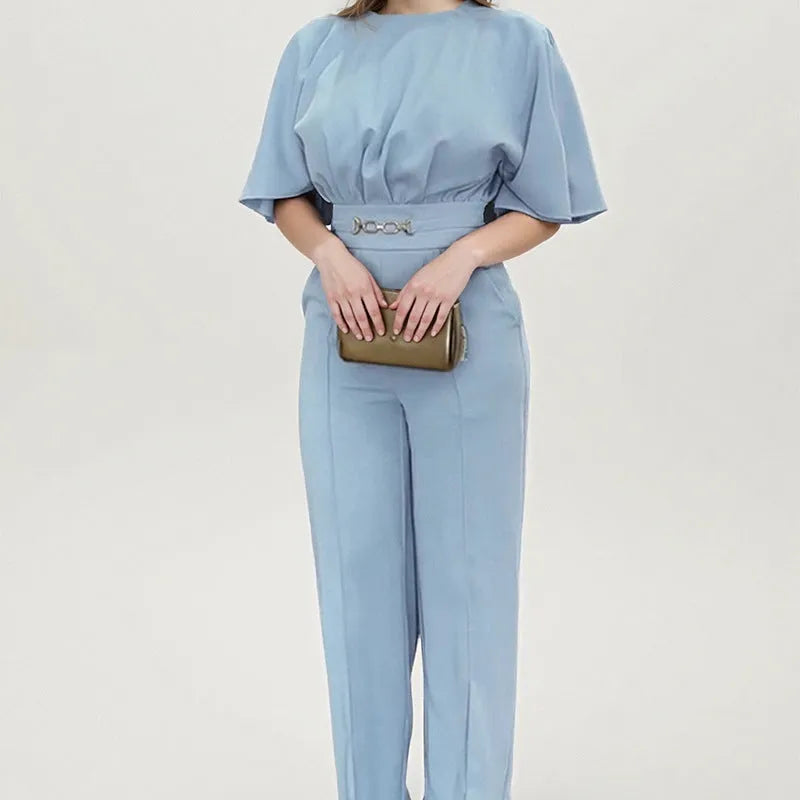 Blue polyester two-piece men's suit with long sleeves and trousers on a hanger