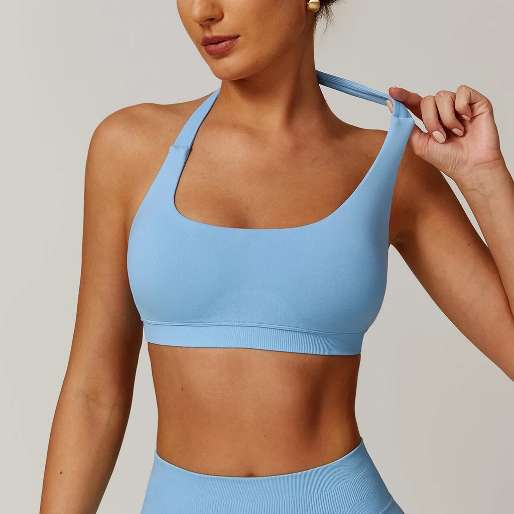 Women's halter sports bra in nylon with removable pads in black, red, purple, brown, or blue