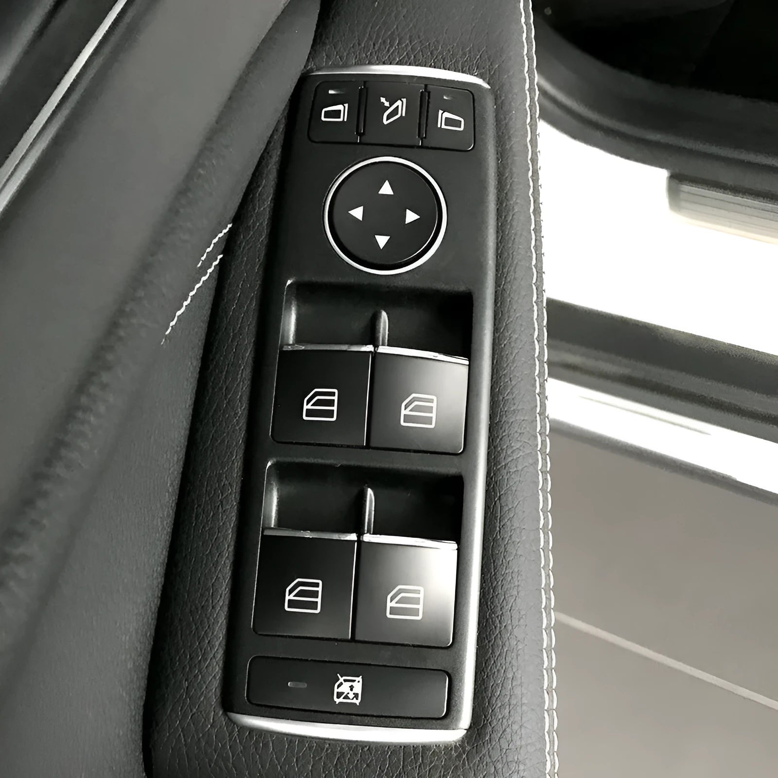 Black glitter decorative sticker for a car window lift button on a door panel